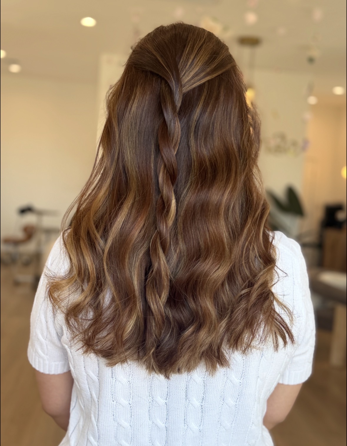 Glossy auburn waves with half-up braid